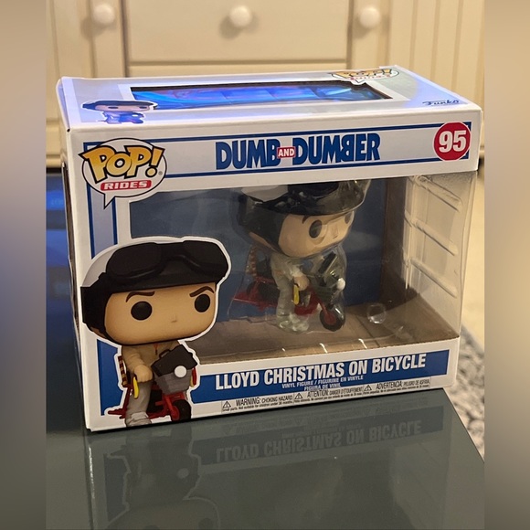 Funko toys funko pop rides dumb dumber lloyd christmas on bicycle jim carrey figurine