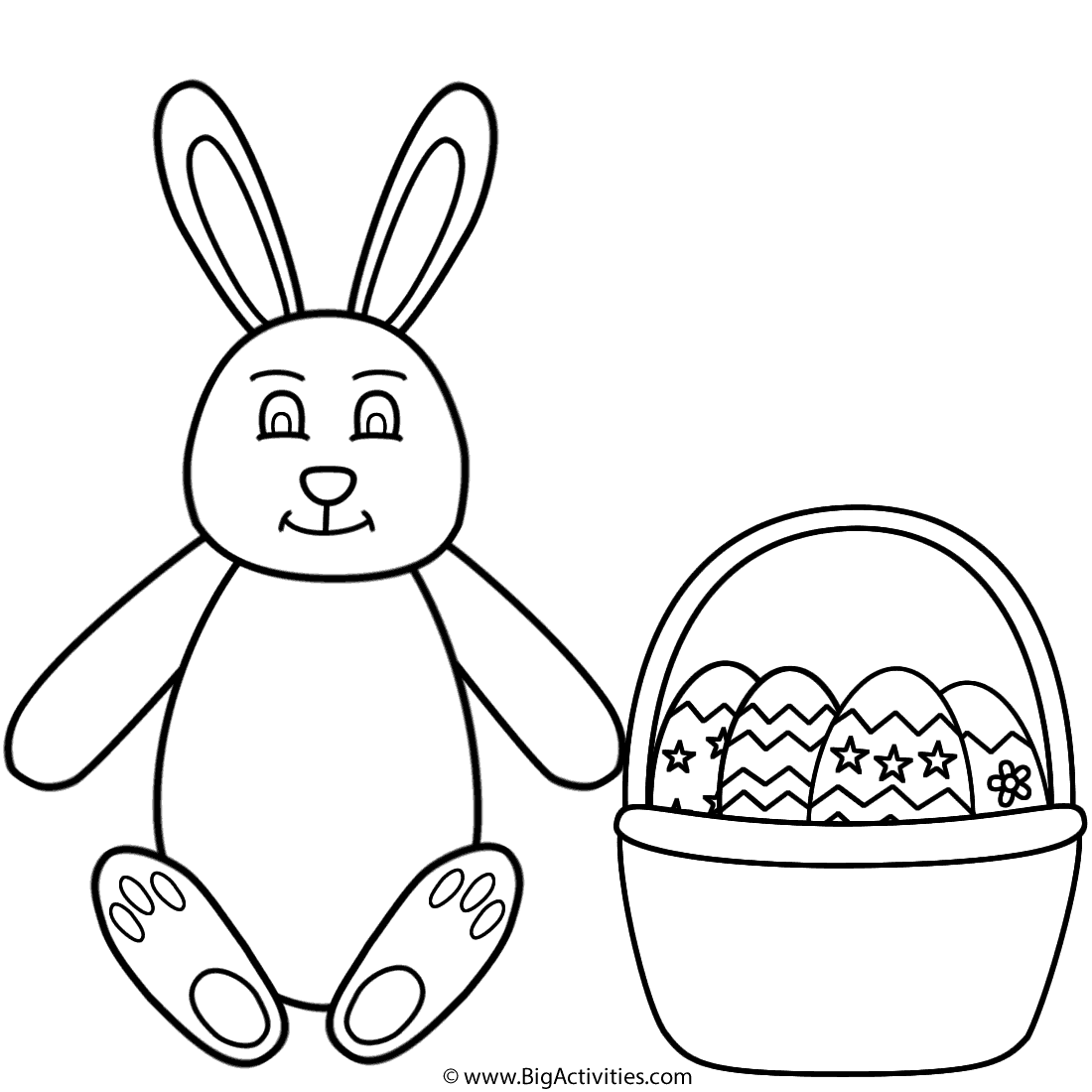 Easter bunny sitting and basket of easter eggs
