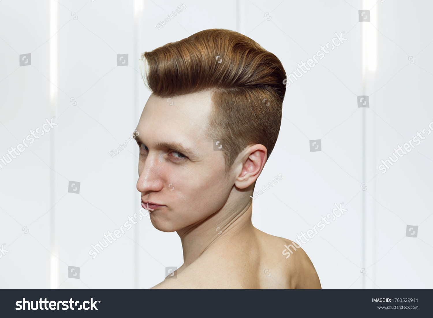 Young ginger guy pompadour haircut real stock photo