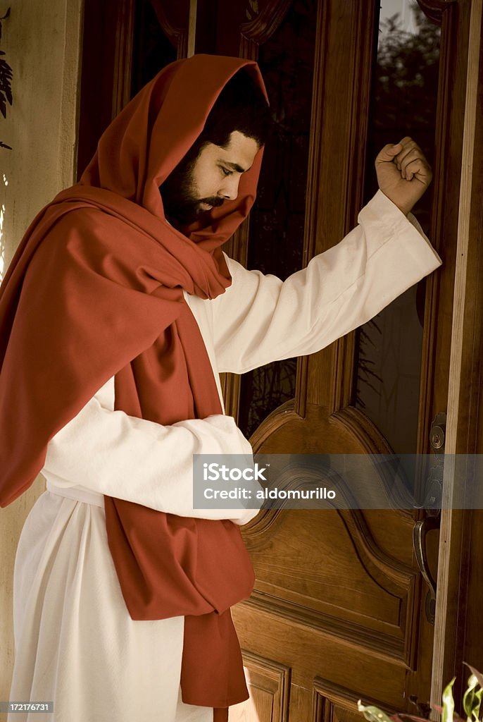Jesus knocking the door stock photo