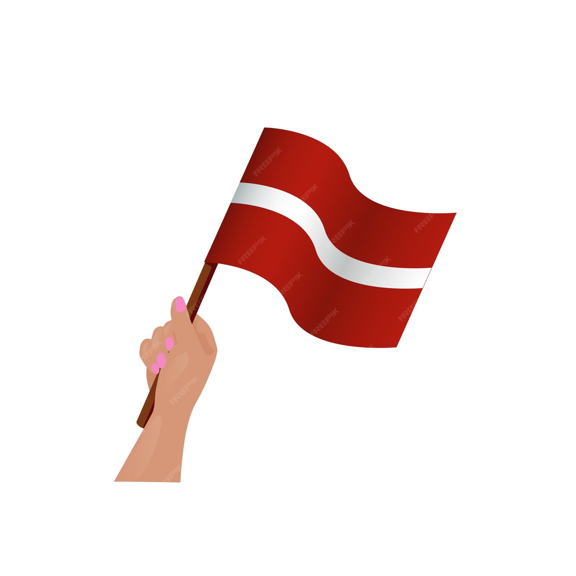 Premium vector hand holding waving latvia flag vector illustration on white background independence day