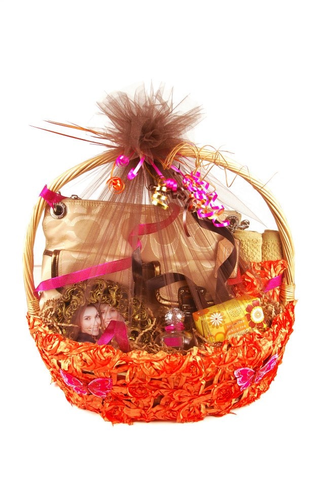 This fashion gift basket color theme is burnt orange and hot pink items inside of fashion gift baskâ fashion gift basket gold picture frames gift baskets