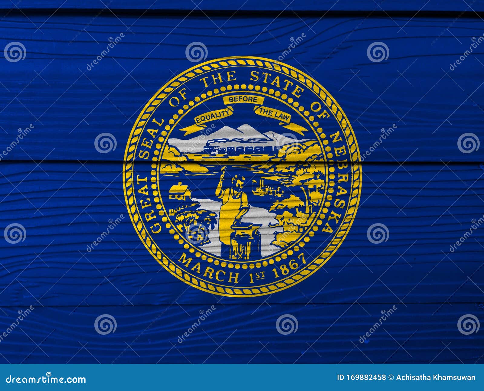 Nebraska flag color painted on fiber cement sheet wall background seal of nebraska in gold on an azure field stock photo