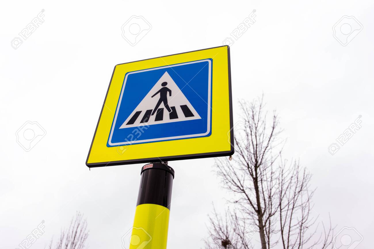 Pedestrian crossing traffic sign in neon yellow and blue colors in the netherlands stock photo picture and royalty free image image