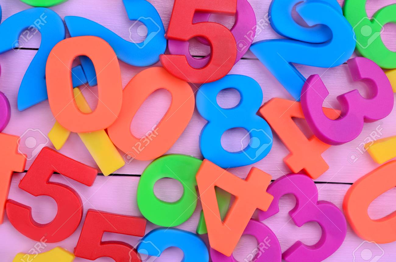 Many colorful numbers on purple wooden table stock photo picture and royalty free image image