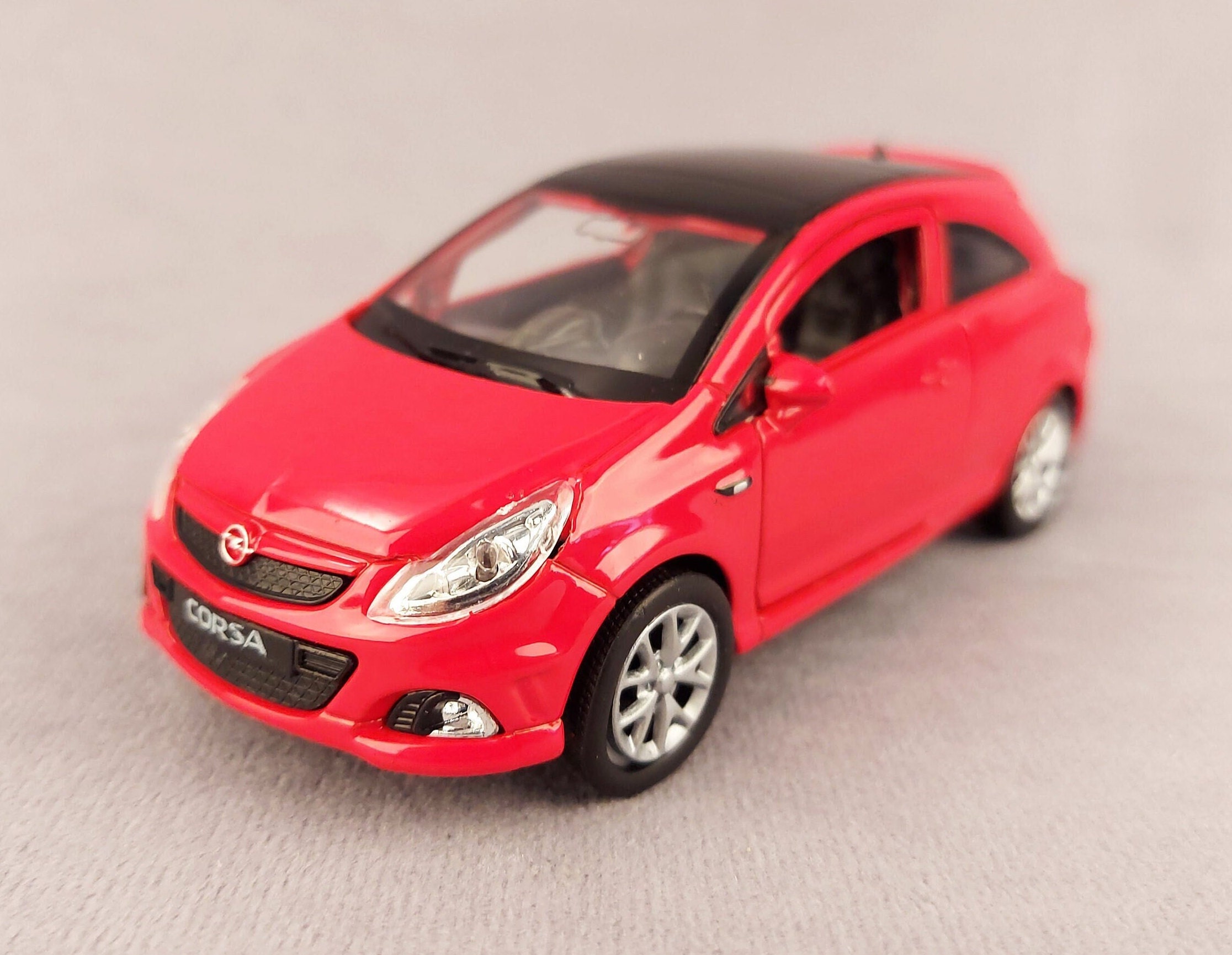 Opel corsa opc welly diecast wooden base and an engraved plaque available with the car purchase at a discount