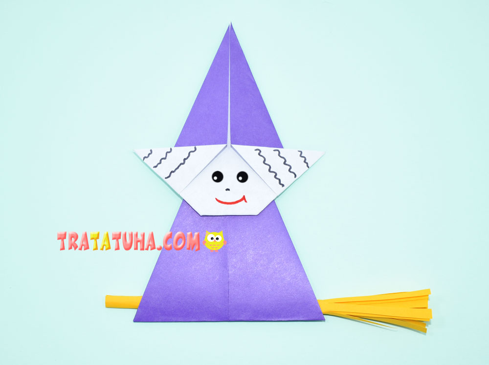 Origami witch on a broomstick