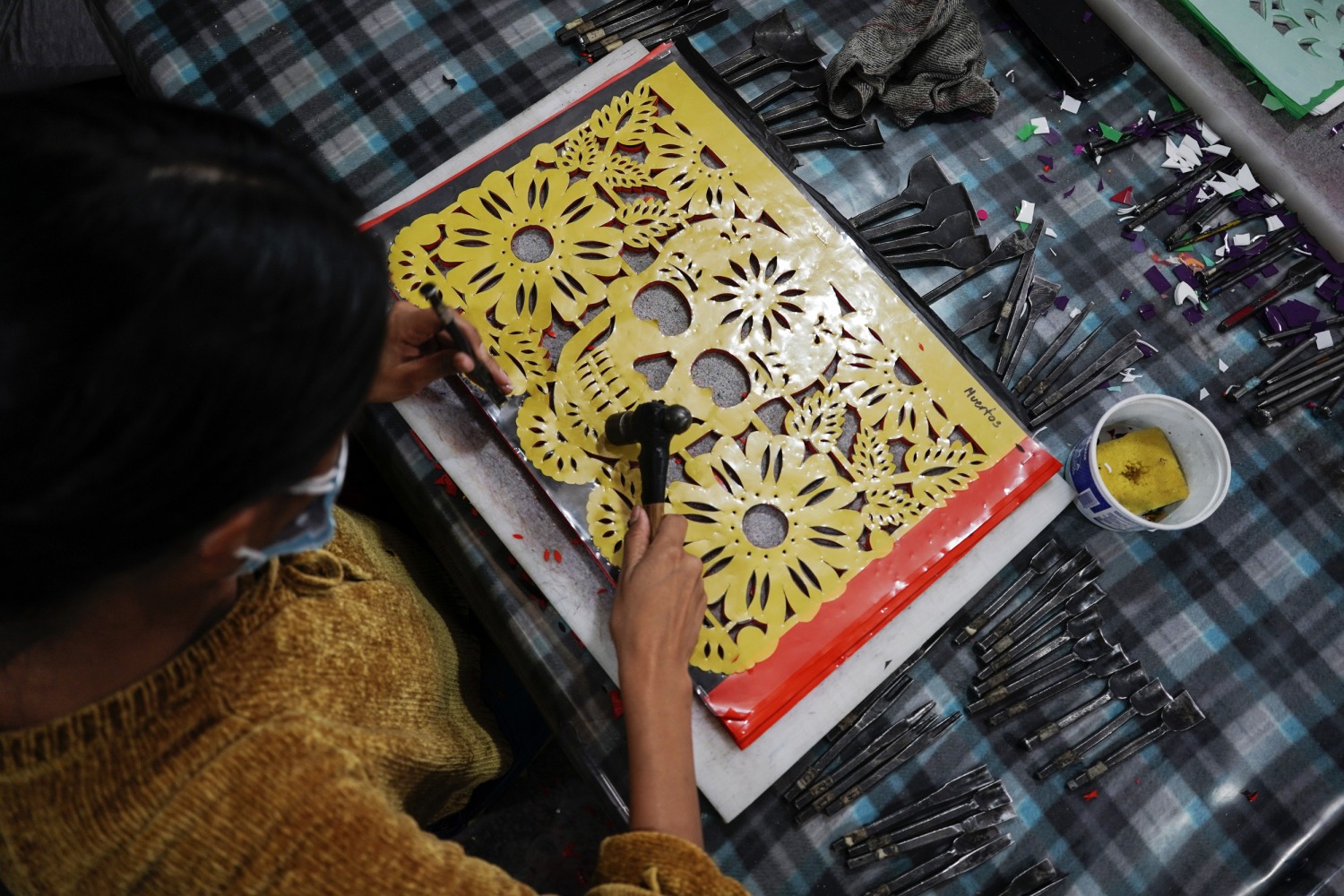 Mexico artisans make traditional papel picado for dia de muertos
