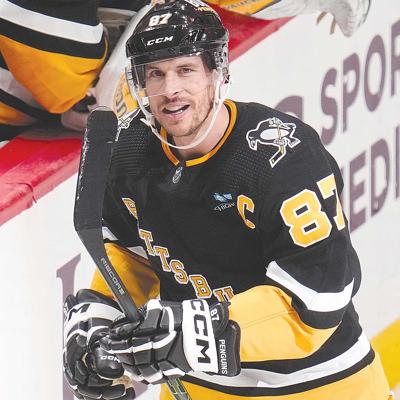 Canucks slip past penguins in ot