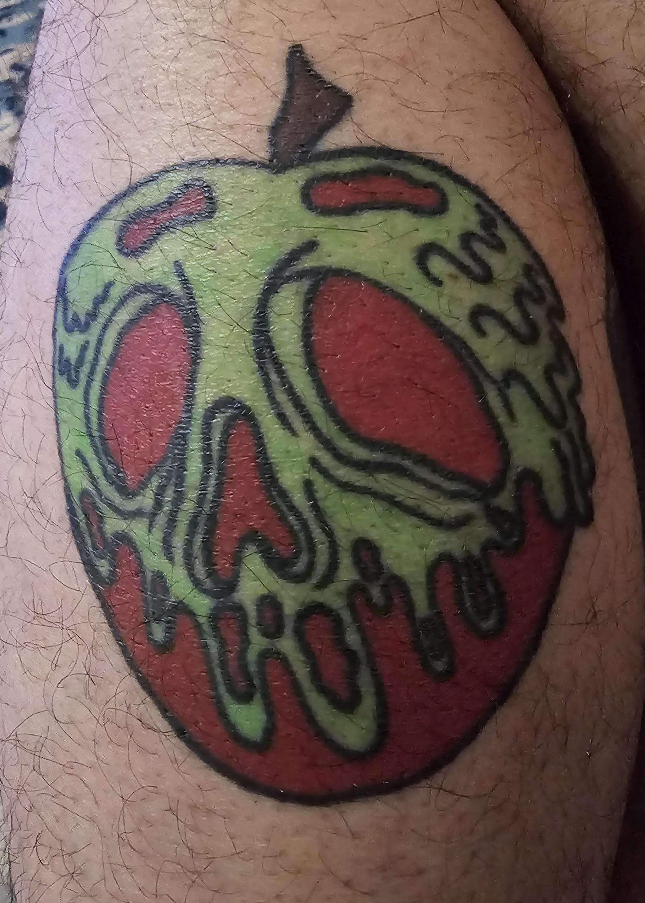 Poison apple with green black light ink done buy sharky in la california rtattoos