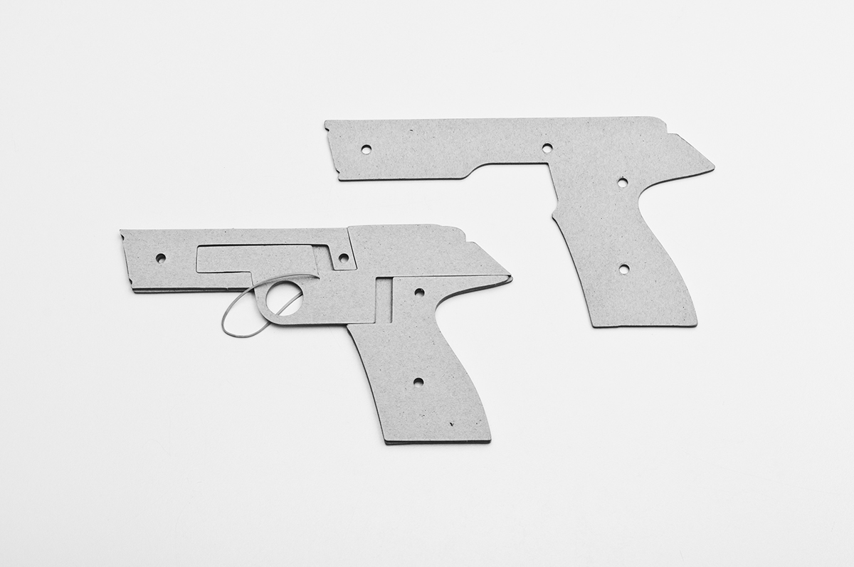 Cardboard rubber band pistol