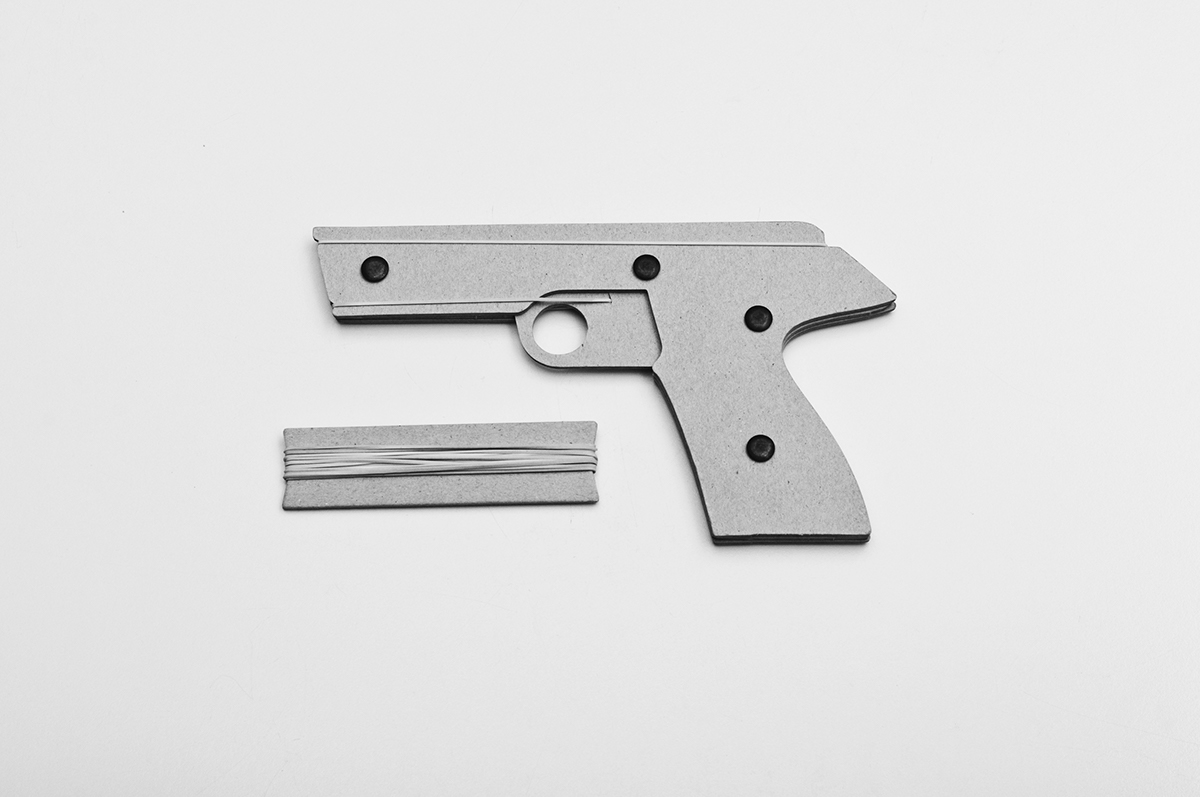Cardboard rubber band pistol