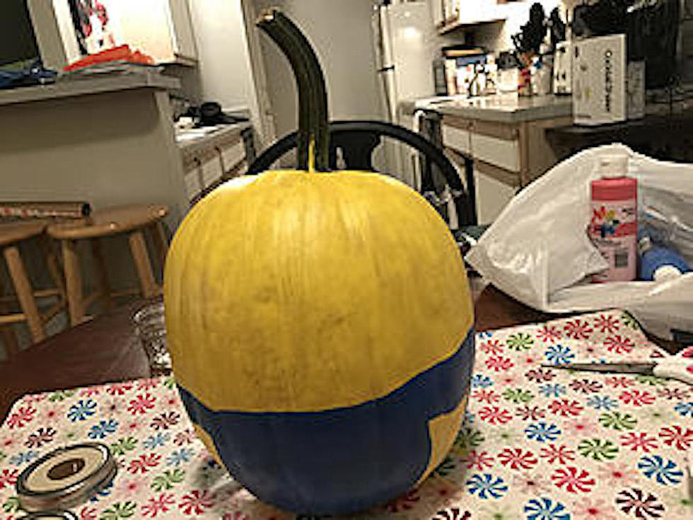 Following cdc guidelines paint this fun minion pumpkin at home