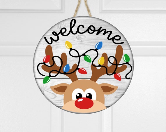 Reindeer tangled in christmas lights reindeer wele sign door hanger