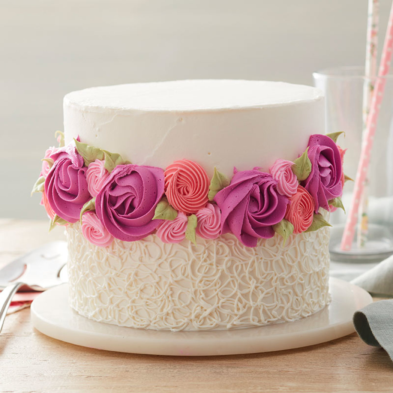 Pink rosette and sotas cake