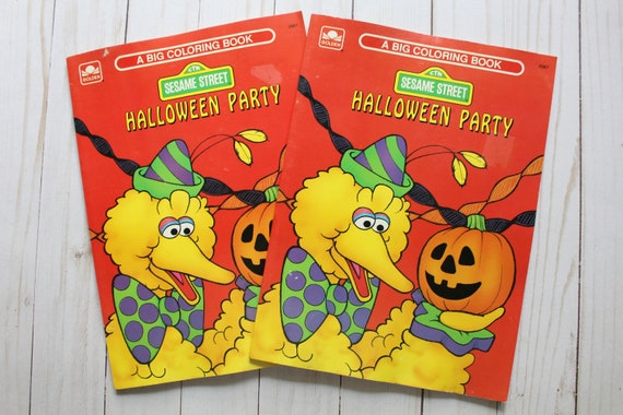 Vintage pair of golden sesame street halloween party coloring books