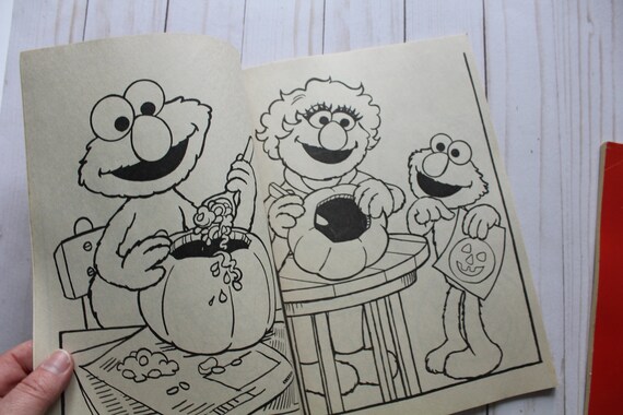 Vintage pair of golden sesame street halloween party coloring books