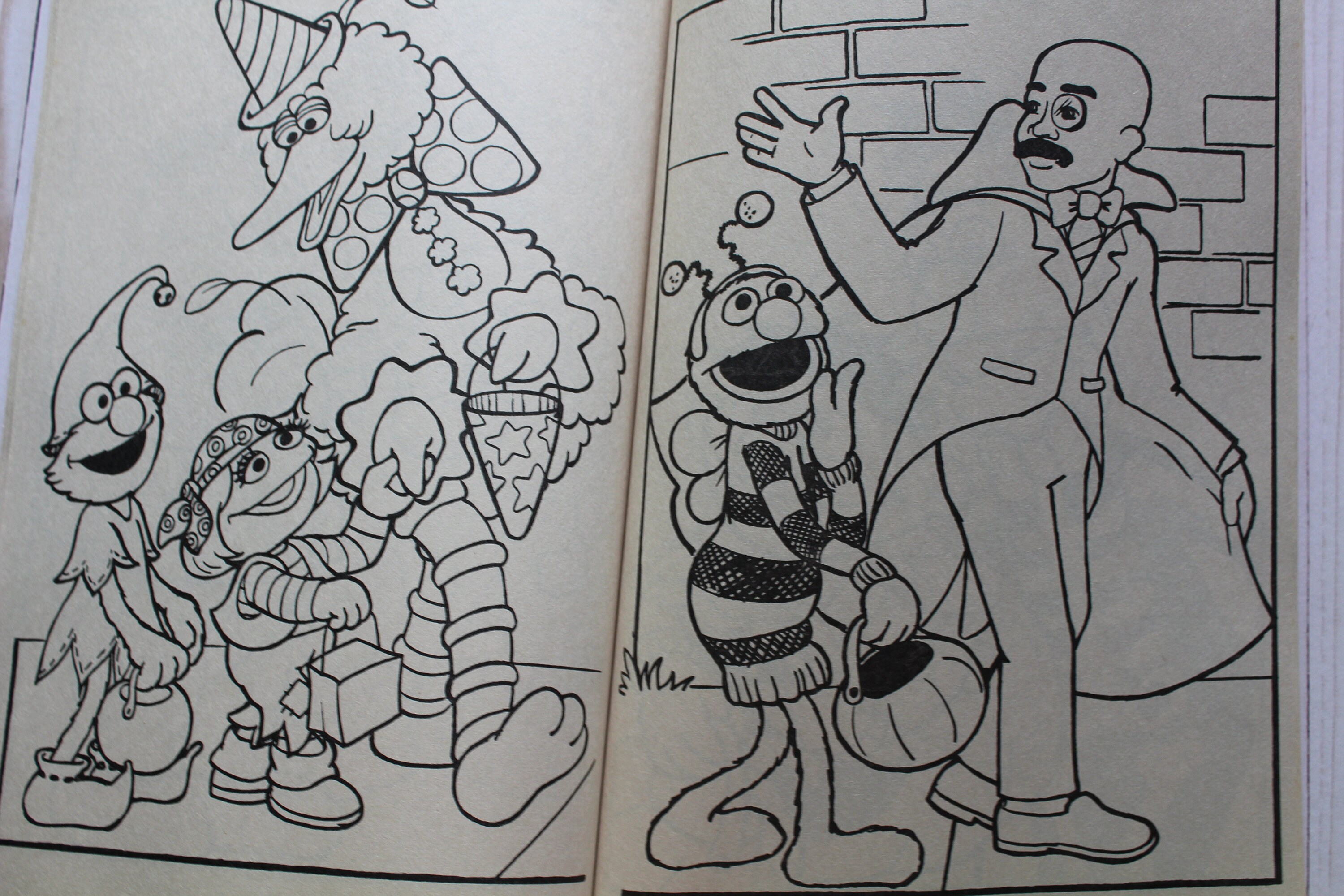 Vintage pair of golden sesame street halloween party coloring books
