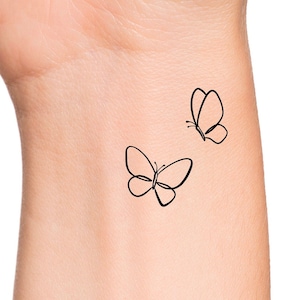 Two butterfly tattoo
