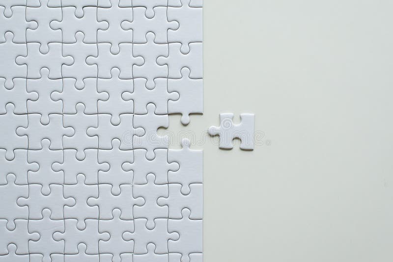 Picture of jigsaw puzzle white colorpuzzle pieces gridmosaic solution templatetop viewcopy space for text stock photo