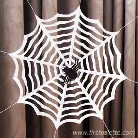Cut paper spider web