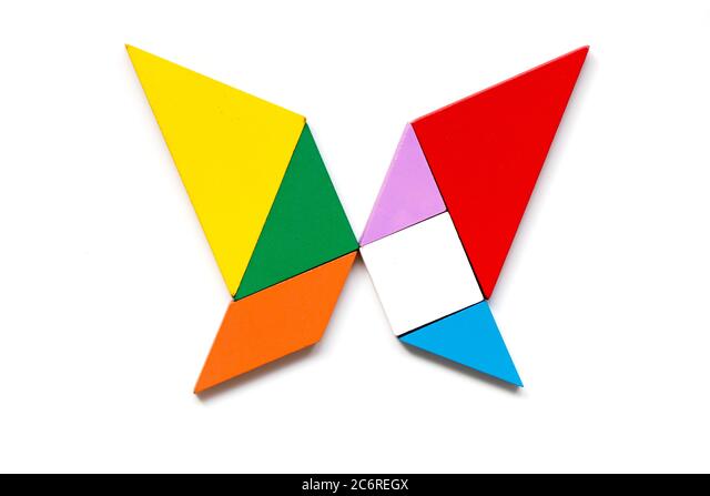 Color wood tangram puzzle in butterfly shape on white background stock photo