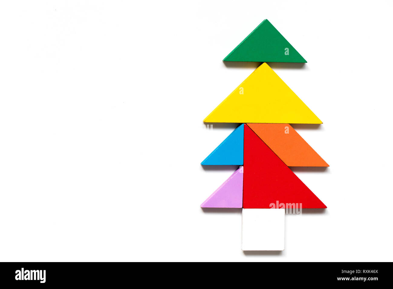 Color wood tangram puzzle in tree shape on white background stock photo