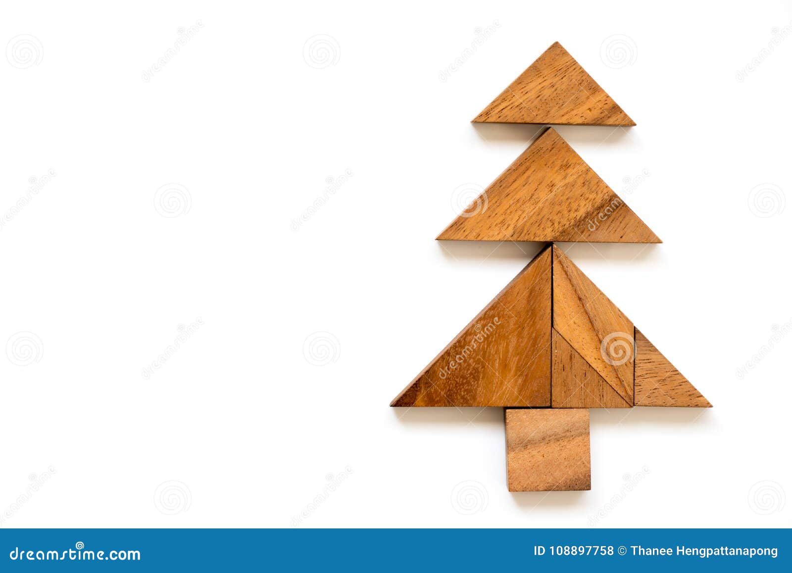 Wood tangram puzzle in christmas tree shape stock photo