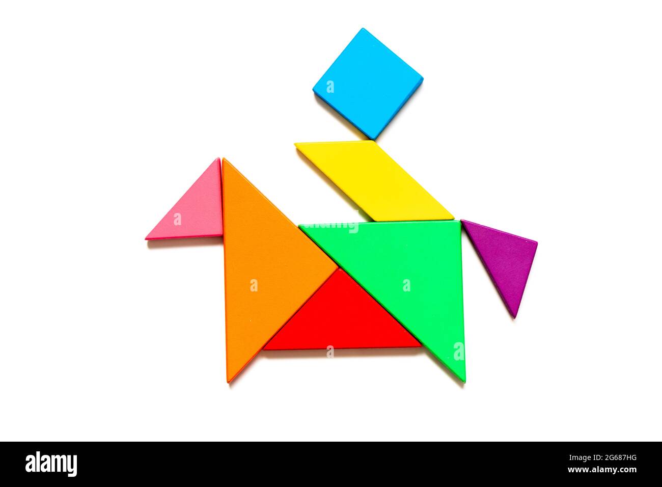 Color tangram puzzle in man ride on the horse shape on white background stock photo