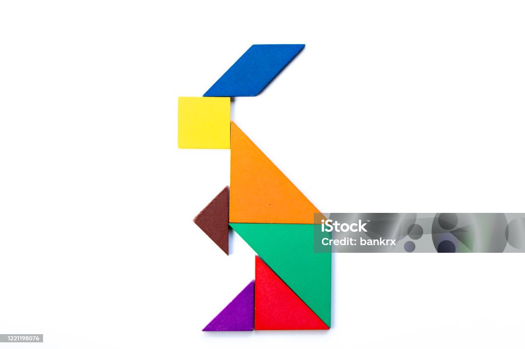 Color wood tangram puzzle in rabbit shape on white background stock photo