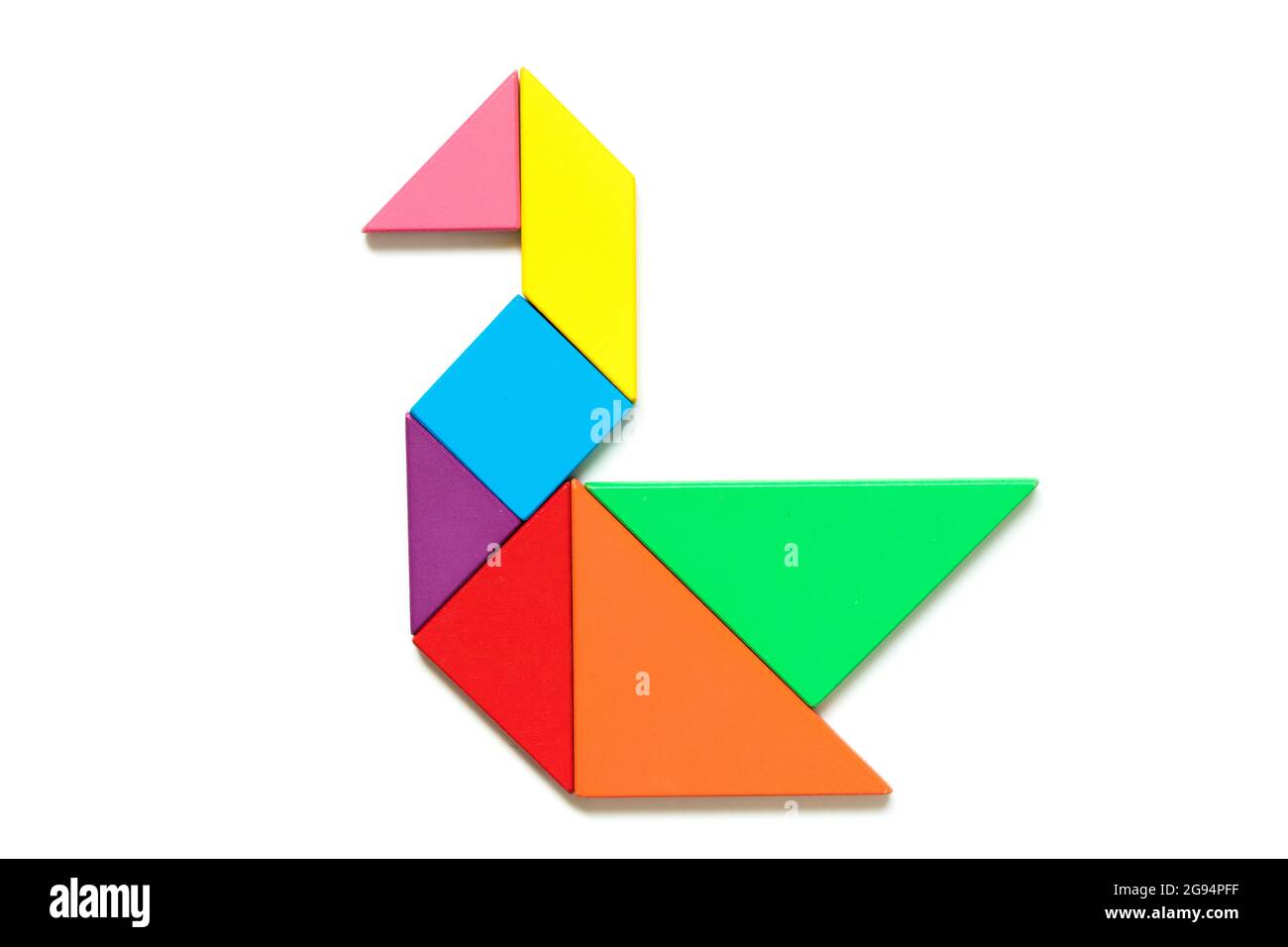Color wood tangram puzzle in swan shape on white background stock photo