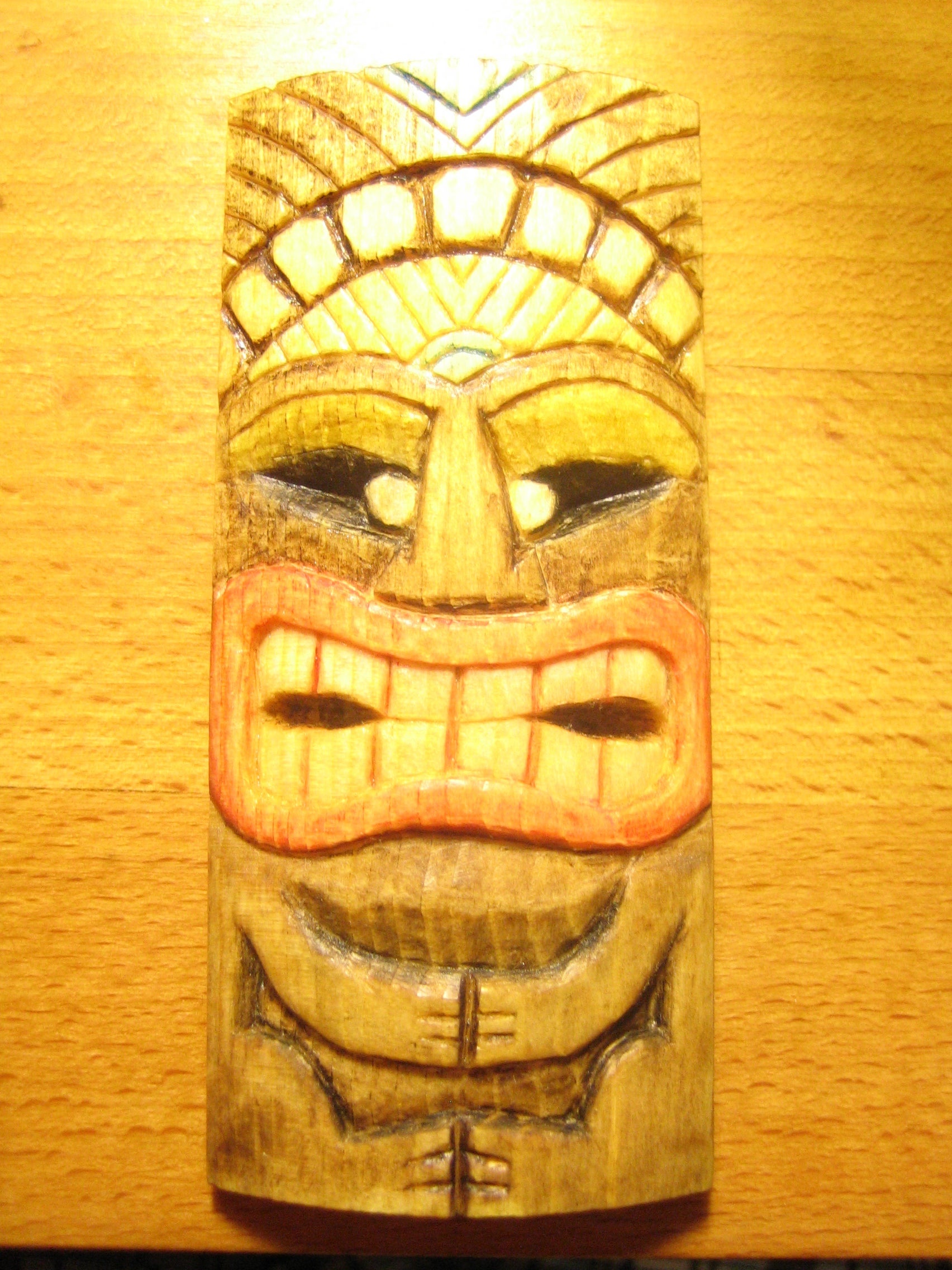 Carve a miniature tiki mask and color it cheaply and eco