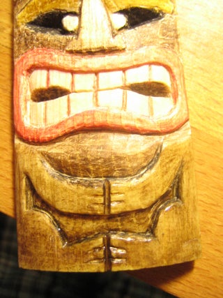 Carve a miniature tiki mask and color it cheaply and eco