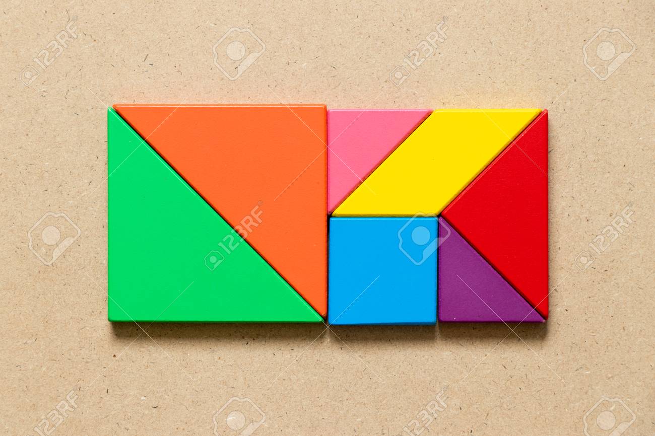 Color tangram puzzle in square or rectangle shape on wood background stock photo picture and royalty free image image