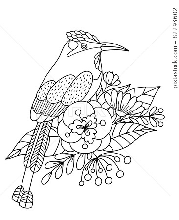 A tropical bird sits on a branch with flowers