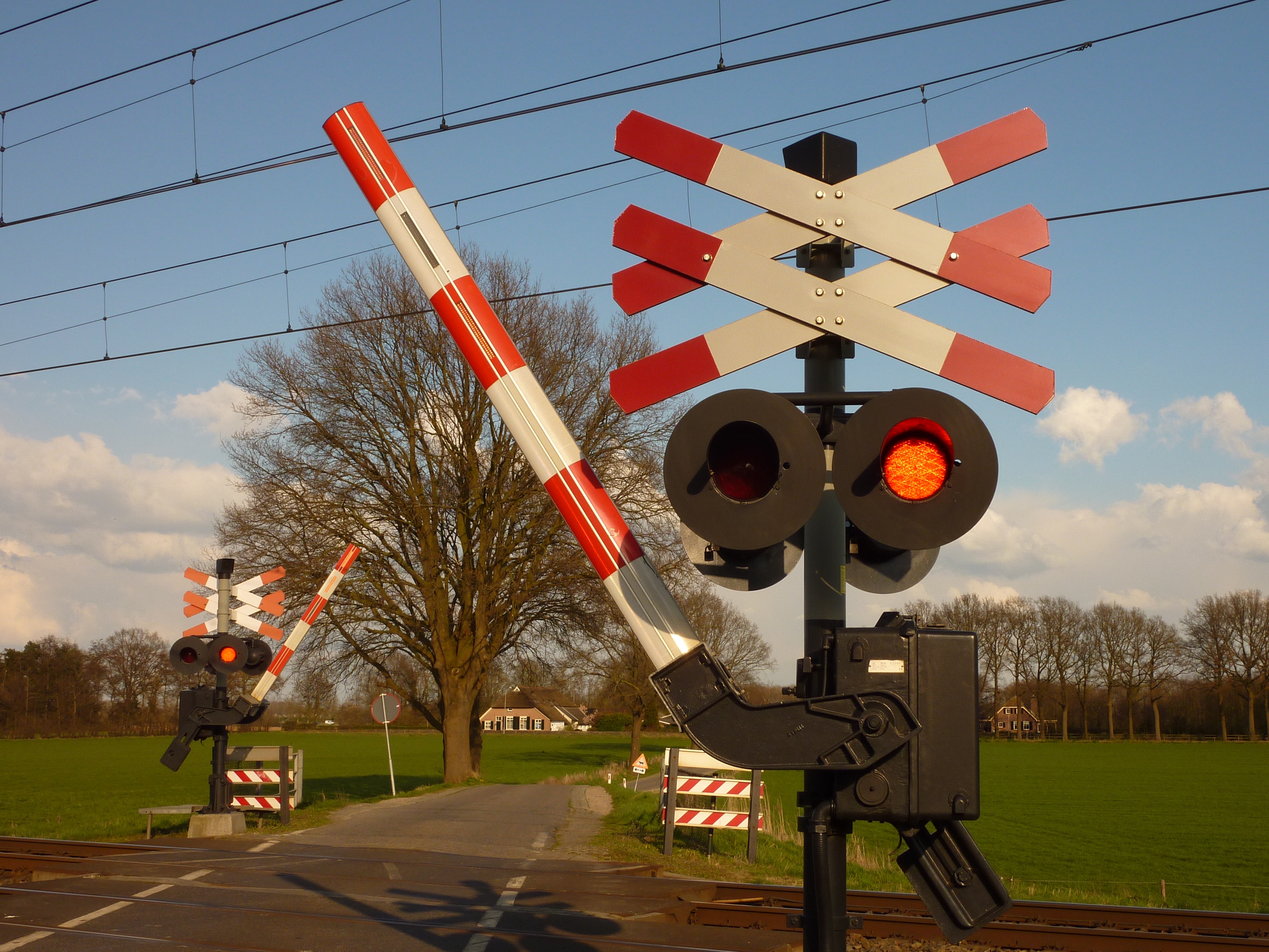Free images road countryside train aircraft transport lighting traffic light netherlands light fixture railway line railway crossing track tree signaling device x