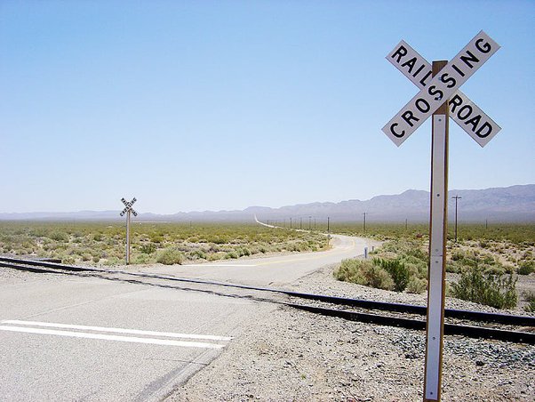 What is a passive railroad crossing
