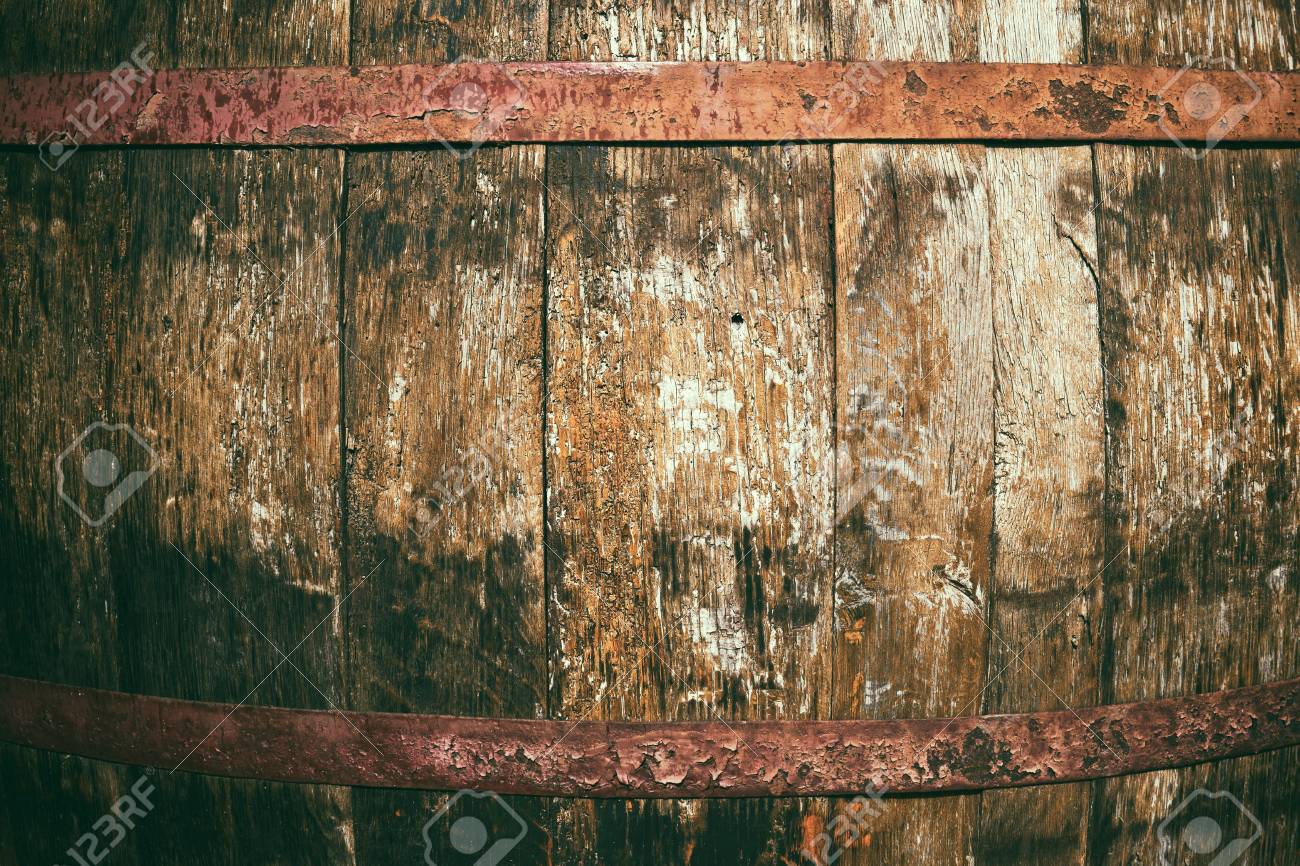 Old large wine barrel with rusty metal hoops old wooden boards background bright abstract background ideal for any design stock photo picture and royalty free image image