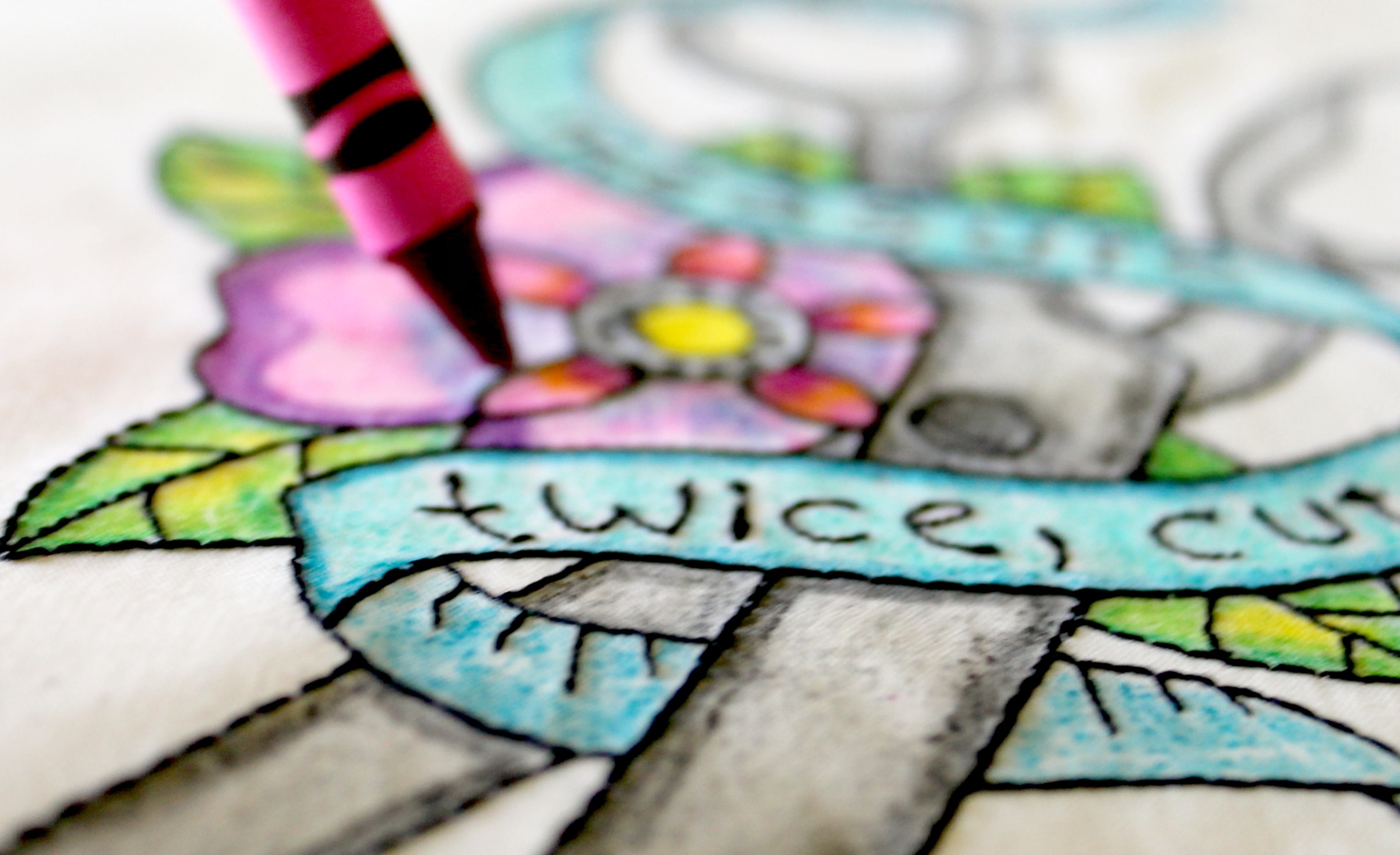 Machine embroidery and coloring with crayons