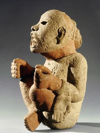 Stone figure of xipe totec the flayed lord aztec mexico c
