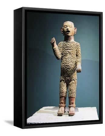 Polychrome ceramic depicting god of eh and spring known as xipe totec our lord the flayed one giclee print